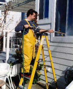 Technician from Interactive Resources conducting AAMA 501.2, Field Check of Metal Storefronts, Curtain Walls, and Sloped Glazing Systems for Water Leakage